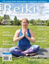 Reiki News Magazine Fall 2019 featuring a woman meditating in a grass field.