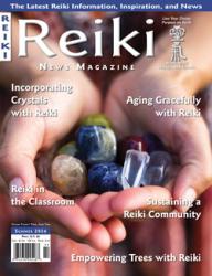 Reiki News Magazine, Summer 2024 cover featuring hands holding crystals, highlighting healing and mindfulness.