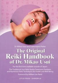 Book cover for “The Original Reiki Handbook of Dr. Mikao Usui,” featuring a woman receiving a relaxing Reiki treatment against a soft pink background.
